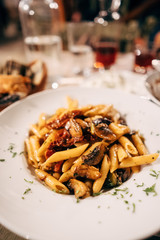 Pasta seashells with minced meat on the table