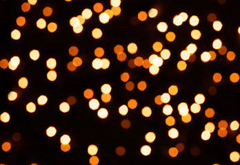 Glitter lights background. Holiday bokeh texture. Multicolored light. Defocused. Christmas background