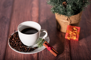 Coffee and other christmas symbol on the wooden table.