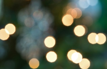 An abstract color image of bokeh Christmas lights from a Christmas tree.