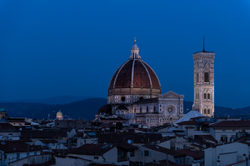 Cityscape, skyline aerial view on Firenze, Italy, Italian city at dark night, twilight, dusk, houses, buildings roofs, rooftops, illuminated Florence Cathedral, Cattedrale di Santa Maria del Fiore
