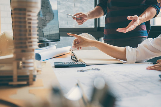 Team of Construction engineering or architect hands working on blueprint inspection in workplace, drawing and sketching meeting for architectural project working with partner