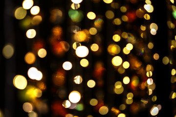 Golden bokeh on dark background.