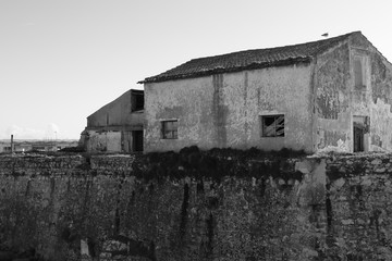 abandoned house in the marina of Peniche in black and white