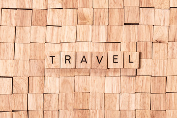 Travel spelled out on wooden letters