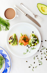 three bruschetta with avocado salmon and cheese