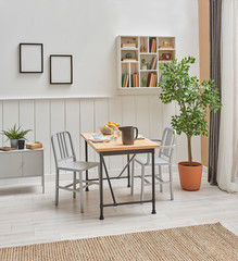 Modern dining room interior room, wooden table, vase of plant and white shelf decoration. wicker carpet floor.
