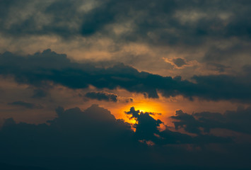 Sunrise the morning light through the clouds.