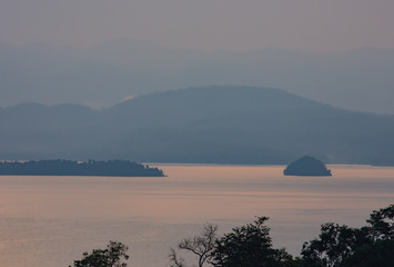 sunrise over Si Nakharin dam at Huay Mae khamin waterfall National Park ,Kanchana buri in Thailand.