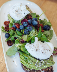 Delicious fresh salad in a rectangular plate on the table