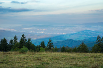 Germany, Sunrise over endless black forest valleys and hills from mountain
