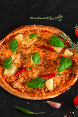 pizza, pineapples, chicken, tomato sauce, vegetables, basil (pizza ingredients). food background. copy space