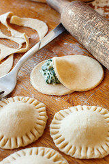 Making ravioli with ricotta cheese and spinach