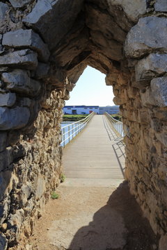 entrance made of stones to a bridge
