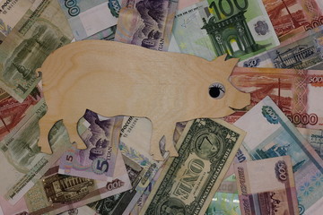 Symbol 2019 pig walks on banknotes of differend countries