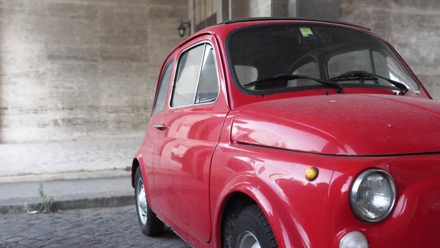 Old, red, small car in Rome. Italy. 4k