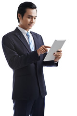 Smiling businessman with tablet