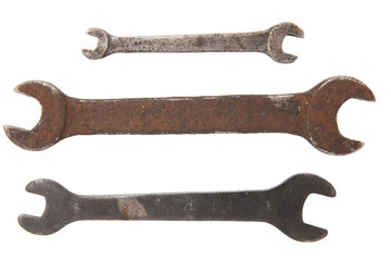three old rusty wrench tools isolated on white background