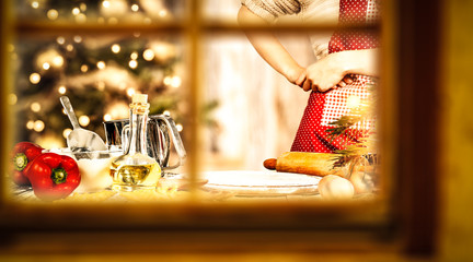 Woman cook in kitchen and winter window space 