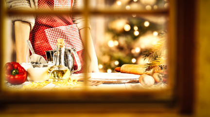 Woman cook in kitchen and winter window space 