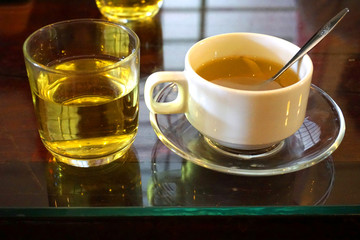 Vietnamese black coffee cup and honey ginger lemon tea with mountain background, coffee shop in highland Da Lat Vietnam  
