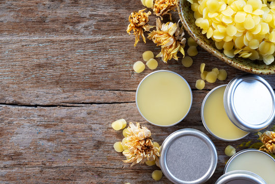 homemde natural lip balm on wooden background.