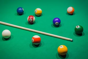 Foto op Plexiglas Billiard balls on pool green table © Nikolai Sorokin