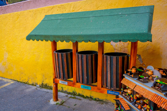 Outdoor view of handycrafts close to a garbage collector in a paper, glass and plastic collector in the Cuicocha lake