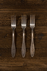 Old cutlery. Top view On a wooden background, Copy space.