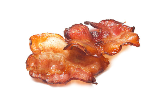 Fried bacon rashers isolated on white background.