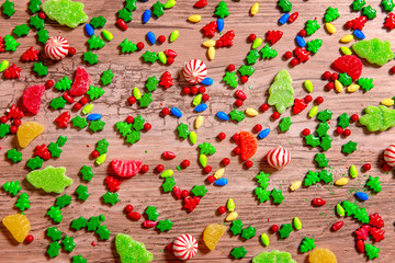 background of Christmas sweets on a wooden table. Christmas candies. Top view, flat lay