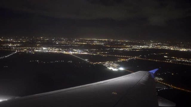 Aeroplane landing night Amsterdam
