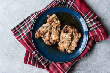 Juicy Chicken Thighs with Sauce of Thyme, Onion and Dried Tomatoes.