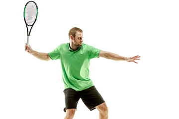 The one caucasian man playing tennis isolated on white background. Studio shot of fit young player at studio in motion or movement during sport game..