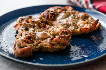 Juicy Chicken Thighs with Sauce of Thyme, Onion and Dried Tomatoes.