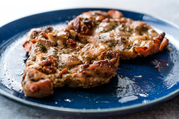 Juicy Chicken Thighs with Sauce of Thyme, Onion and Dried Tomatoes.