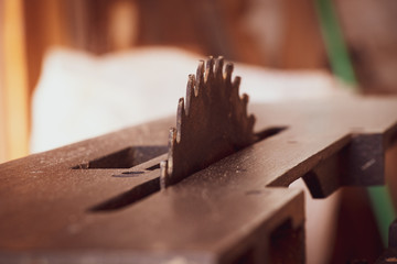 circular saw with carpenter store blur background