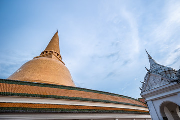 Wat Phra Pathom Chedi in blue sky, Thailand. Golden stupas.