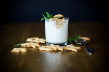 sweet homemade yogurt with cookies in a glass cup