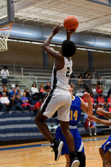 Young high school athletes making great basketball plays during a game