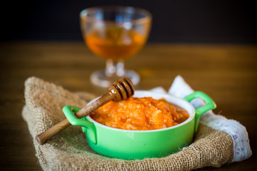 Boiled sweet pumpkin porridge with rice in a plate
