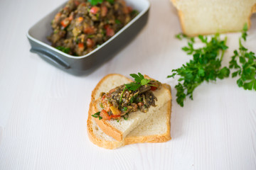 eggplant caviar with tomatoes and a slice of bread