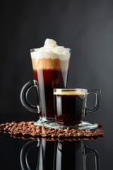 Various coffee drinks on a black background.