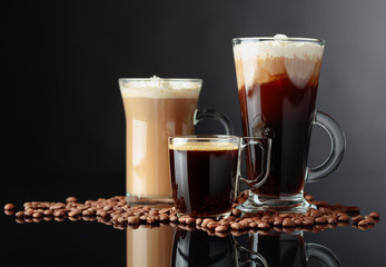 Various coffee drinks on a black background.