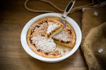 sweet cake with jam in ceramic form