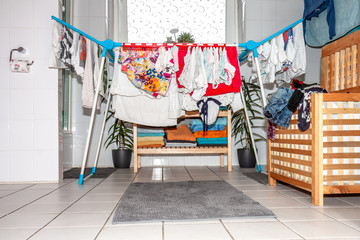 Huge amount of laundry drying in the bathroom