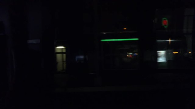 man driving across inner downtown Manhattan, New York, USA at night close to Times Square