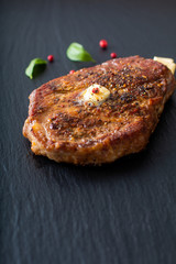 Food concept Marinated Sirloin meat steak on black slate stone plate with copy space
