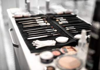 Close up of professional brushes set for makeup locating on table