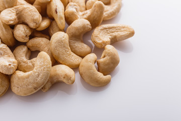 cashew nuts on a white acrylic background